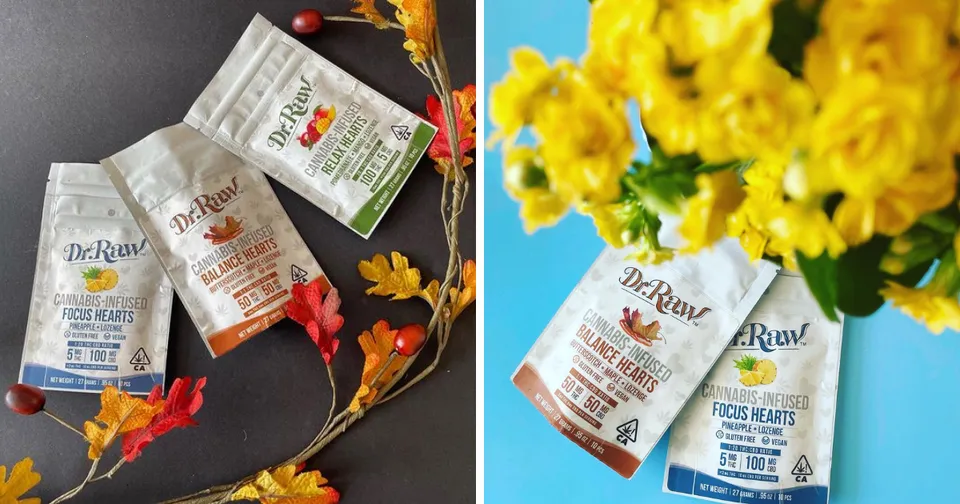 Three small scented sachet packets with floral designs beside yellow flowers on a dark tabletop.