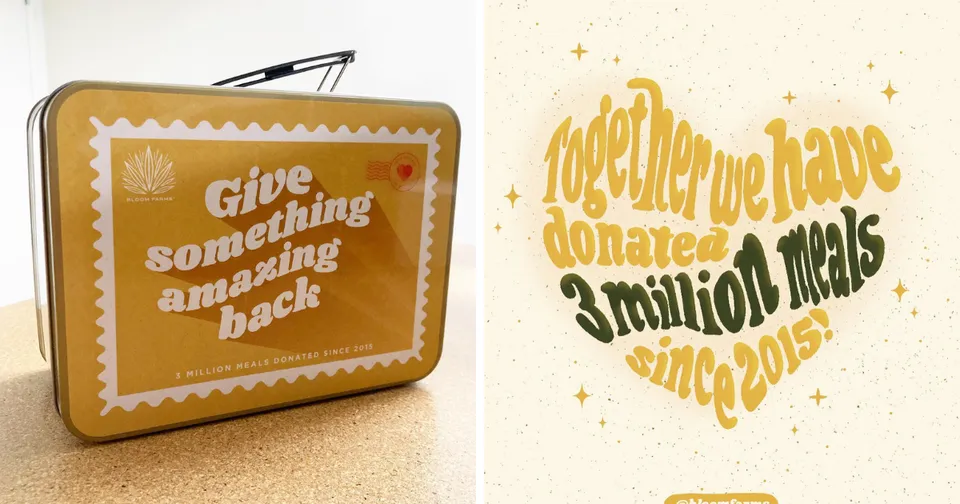 Orange lunchbox with “Give something amazing back” beside gold motivational wall text.