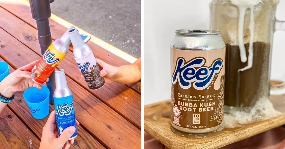 Hands holding orange and blue Keef cans over a wooden table; one can pours into a glass with ice.
