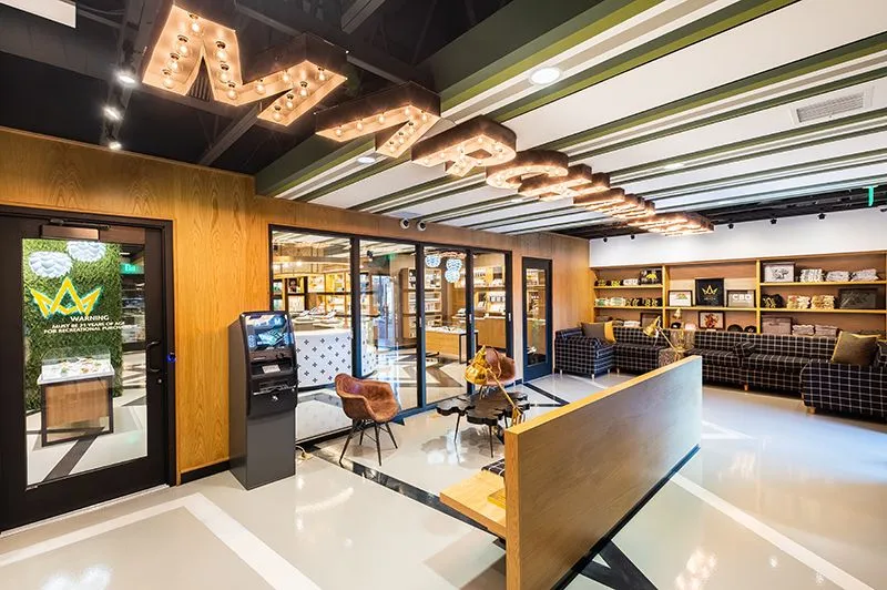The Mission Valley lobby with reception counter, seating and the illuminated March and Ash sign.