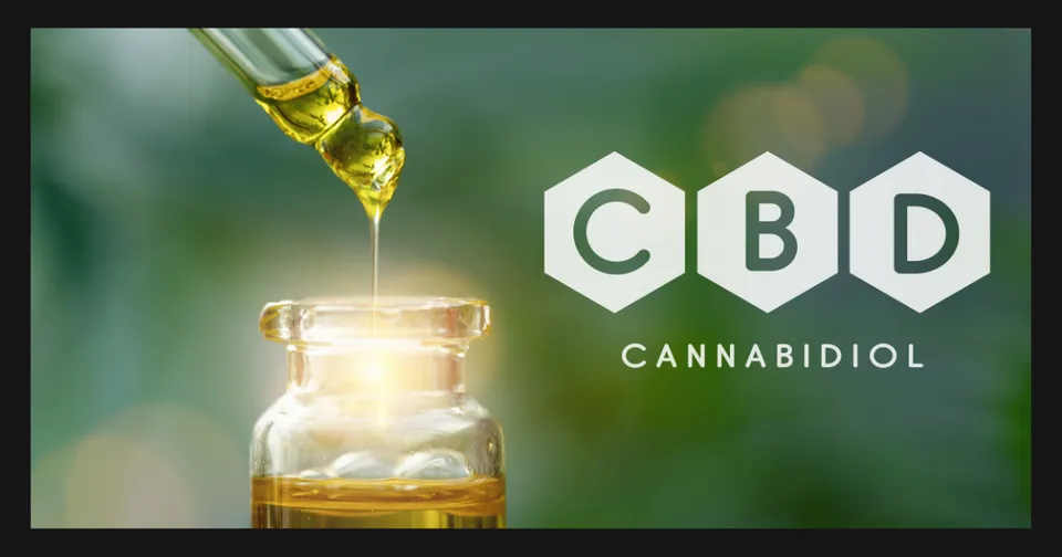 CBD oil dropper dispensing into a glass jar beside a green CBD Cannabidiol logo